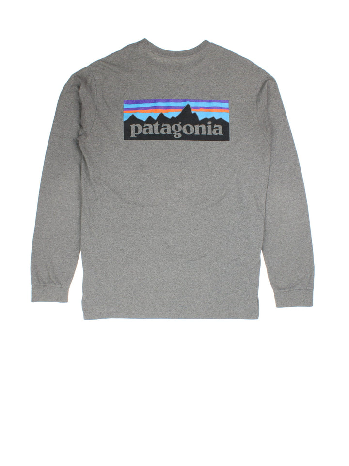 Vintage Patagonia Long Sleeve T-Shirt in a grey colourway with the logo on front and back.