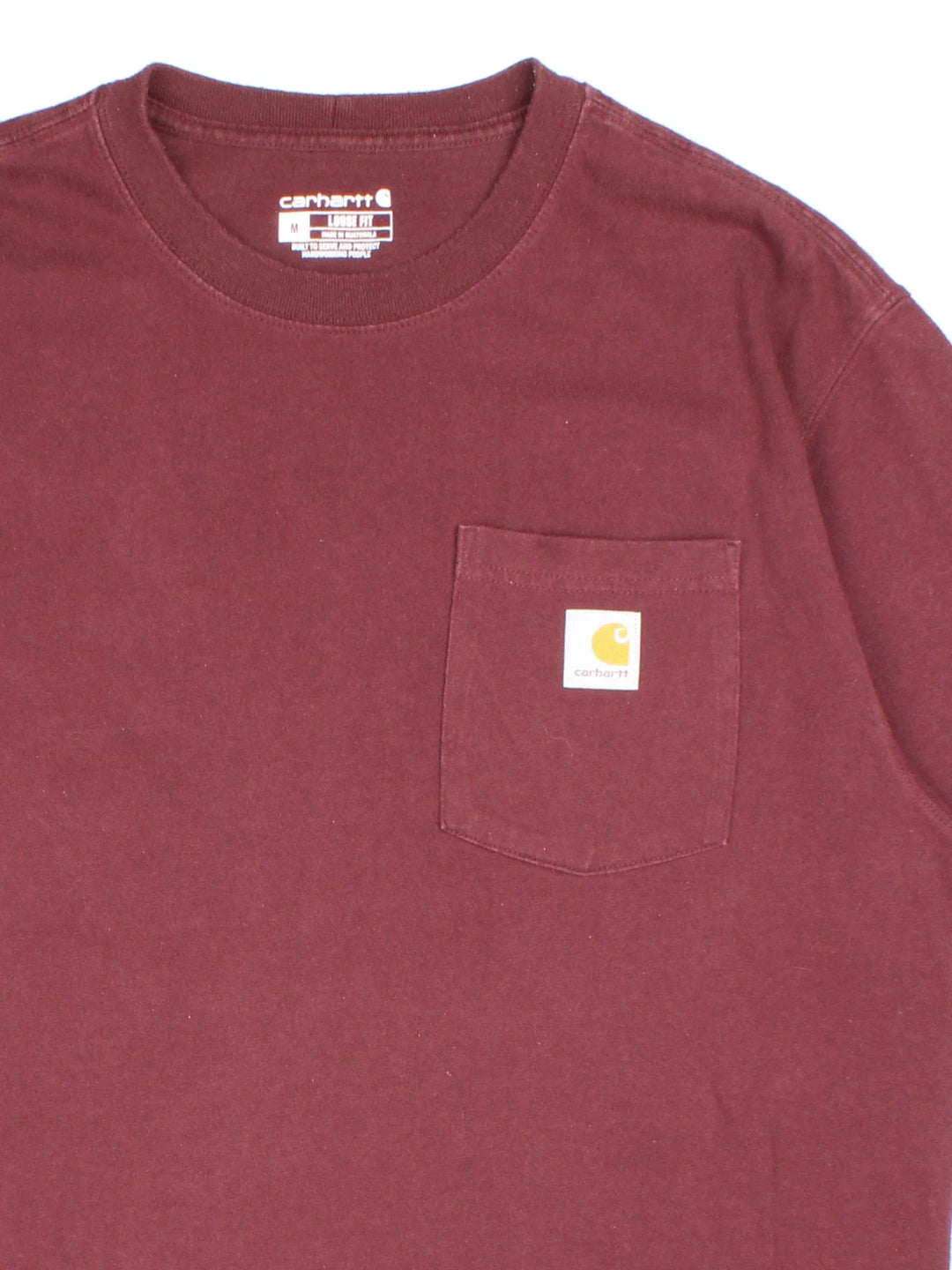 Vintage Carhartt T-Shirt in a red colourway with front pocket and logo embroidered on the front.