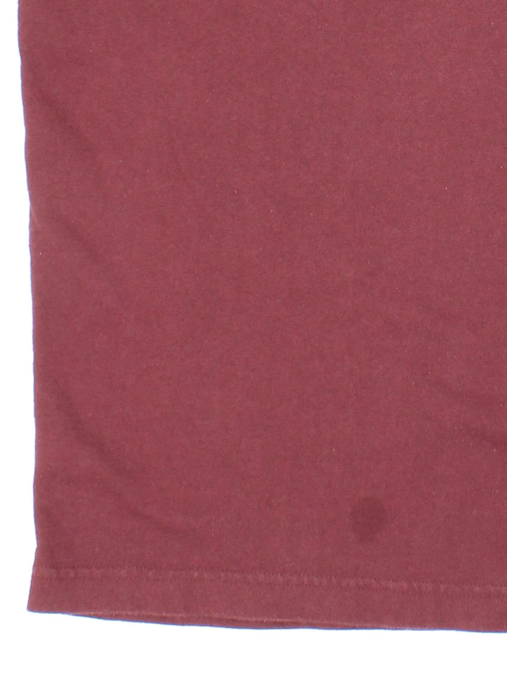 Vintage Carhartt T-Shirt in a red colourway with front pocket and logo embroidered on the front.