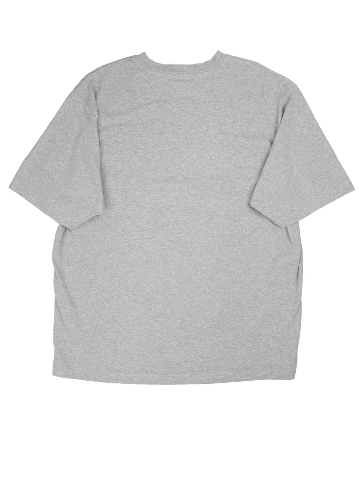 Vintage Carhartt T-Shirt in a grey colourway with front pocket and logo embroidered on the front.