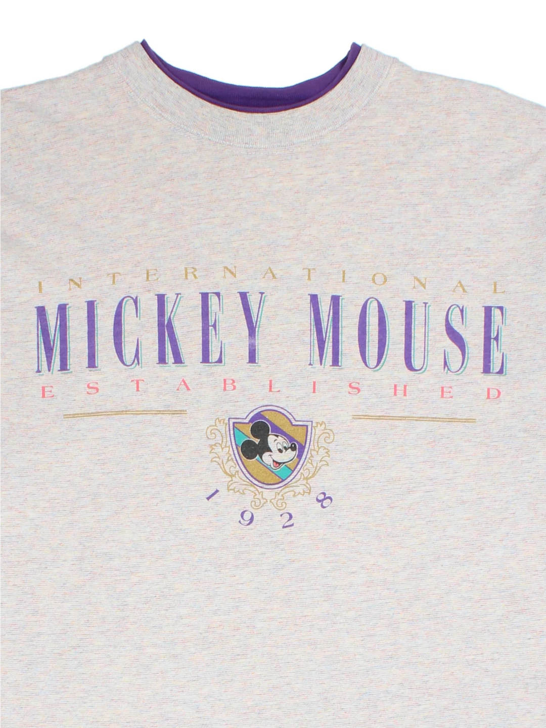 Vintage Disney Mickey Mouse T-Shirt in a grey colourway with the logo printed on the front and a purple trim around the collar.