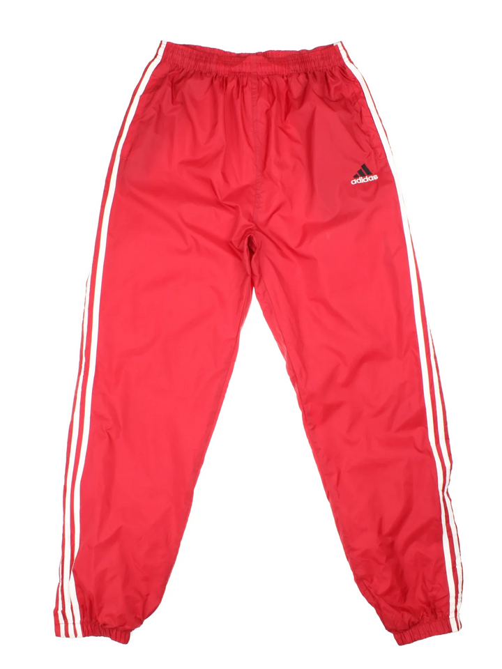 Adidas Tracksuit Bottoms in red colourway. Side pockets, classic contrast x3 stripe branding and the logo embroidered on the front.