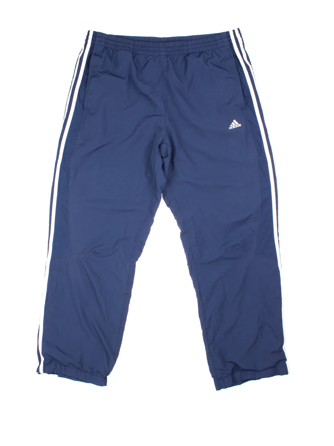 90's Adidas Tracksuit Bottoms in blue colourway. Side pockets, elasticated waist and the logo embroidered on the front.