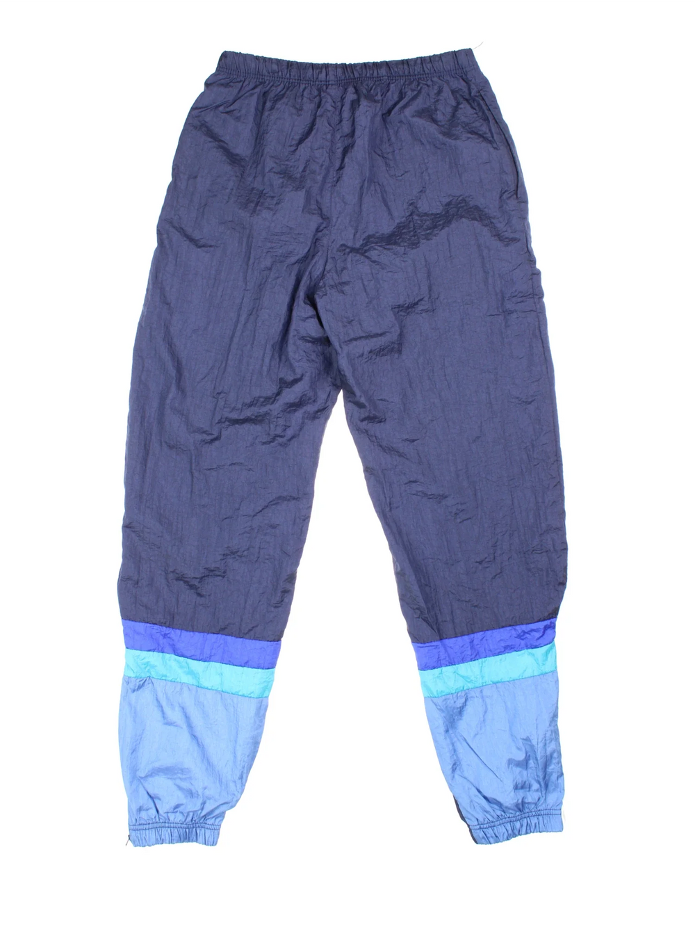 90's Sergio Tacchini Tracksuit Bottoms in blue colourway. Side pockets, elasticated waist and the logo embroidered on the front.