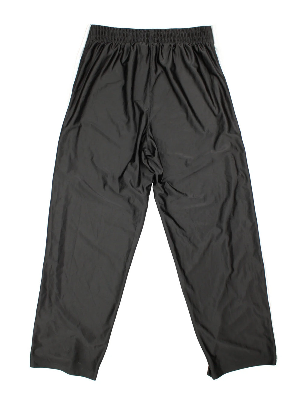 90's Nike Tracksuit Bottoms in black colourway. Side pockets, contrast piping and the logo embroidered on the front.