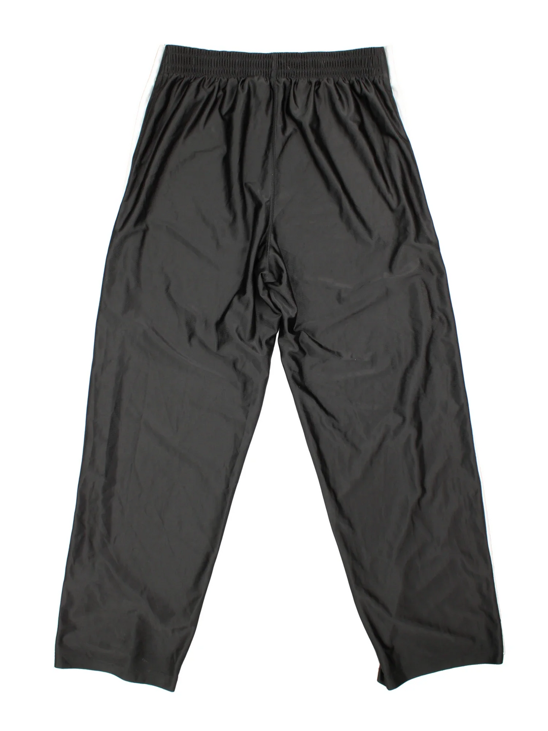 90's Nike Tracksuit Bottoms in black colourway. Side pockets, contrast piping and the logo embroidered on the front.