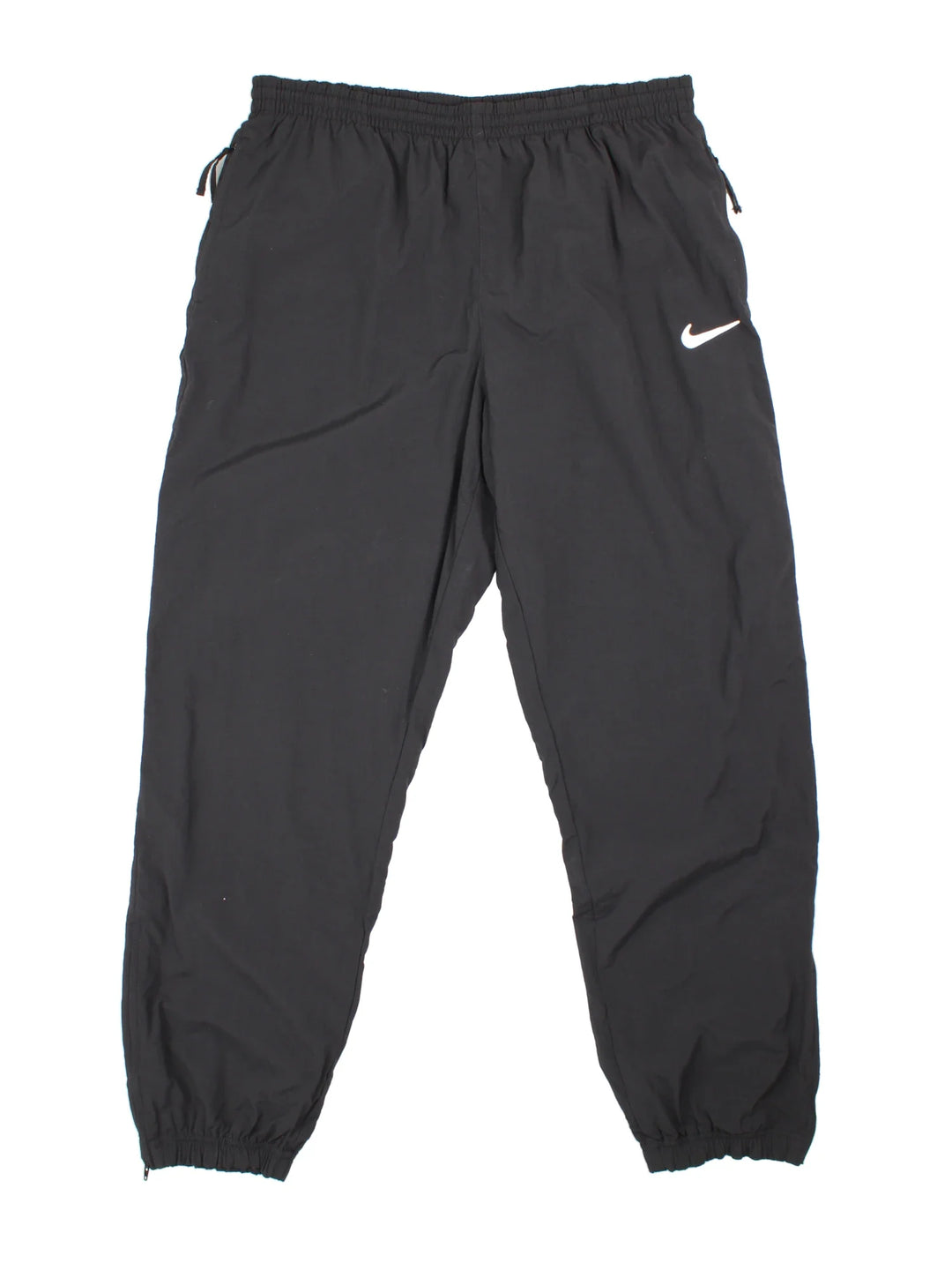 90's Nike Tracksuit Bottoms in black colourway. Side pockets, elasticated waist and the logo embroidered on the front.