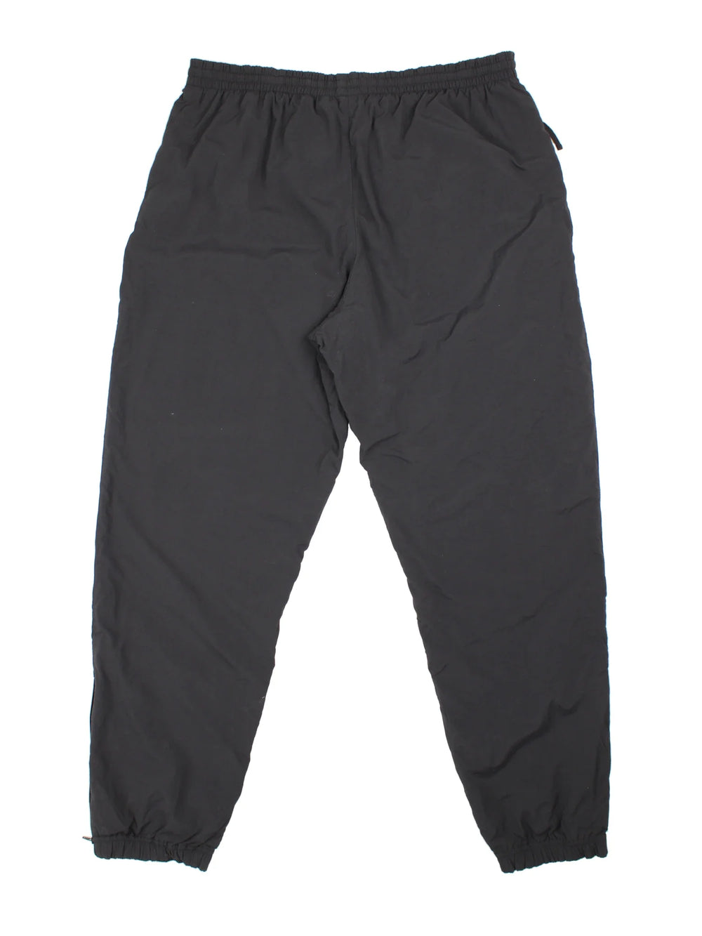 90's Nike Tracksuit Bottoms in black colourway. Side pockets, elasticated waist and the logo embroidered on the front.
