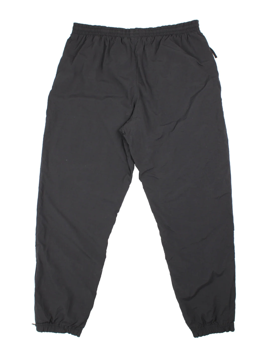90's Nike Tracksuit Bottoms in black colourway. Side pockets, elasticated waist and the logo embroidered on the front.