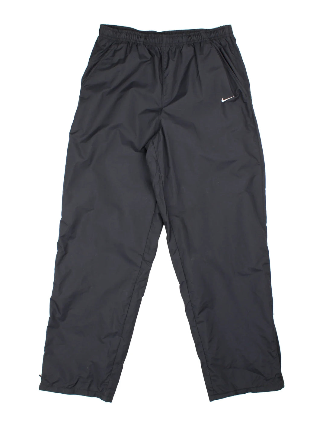 90's Nike Tracksuit Bottoms in black colourway. Side pockets, elasticated waist and the logo embroidered on the front.