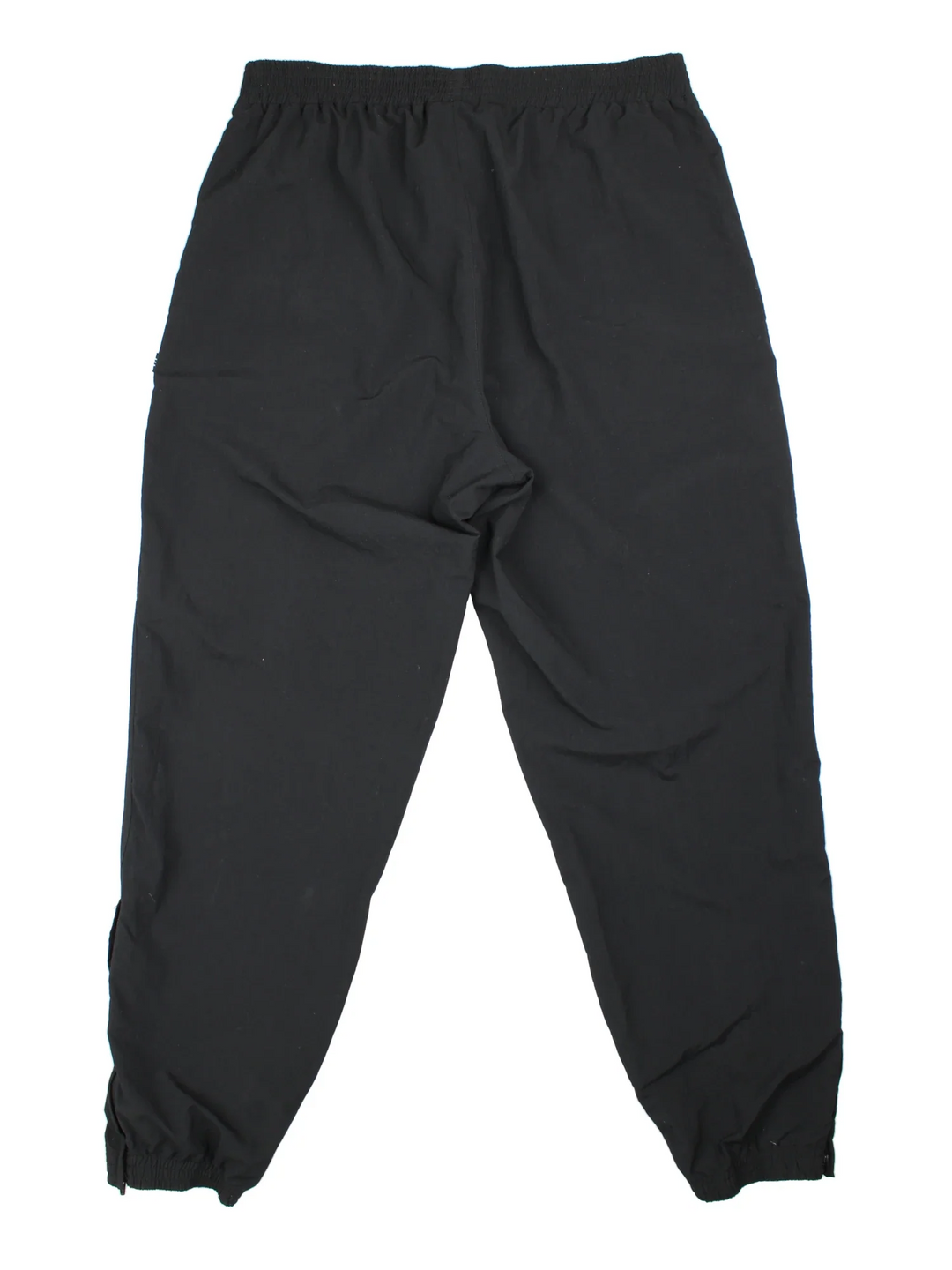 90's Adidas Tracksuit Bottoms in black colourway. Side pockets, elasticated waist and the logo embroidered on the front.