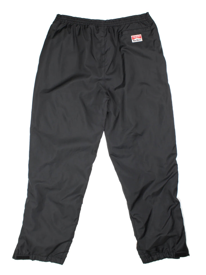 90's Marlboro Classics Insulated Tracksuit Bottoms in black colourway with cuffed hem. Zipper ankle leg, side zip pockets and the logo embroidered on the back.