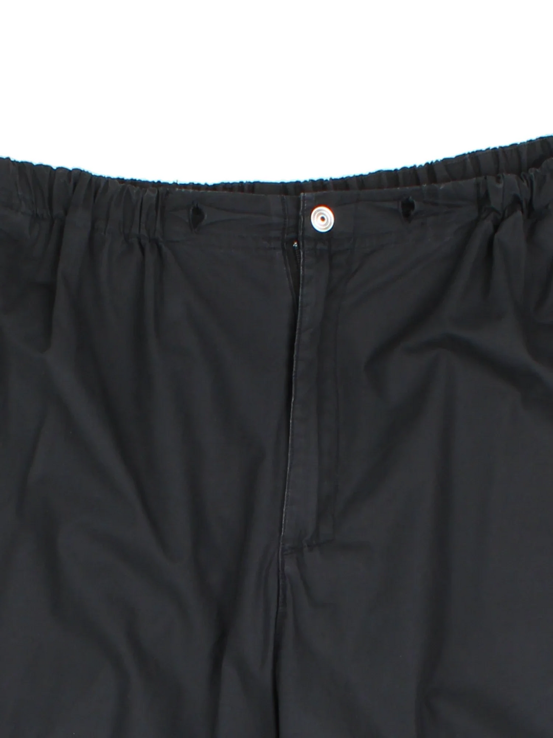Adidas Shell Trousers in a black colourway with iconic three stripes going down the sides, has multiple pockets, elasticated waist. high waisted, and the logo printed on the back.