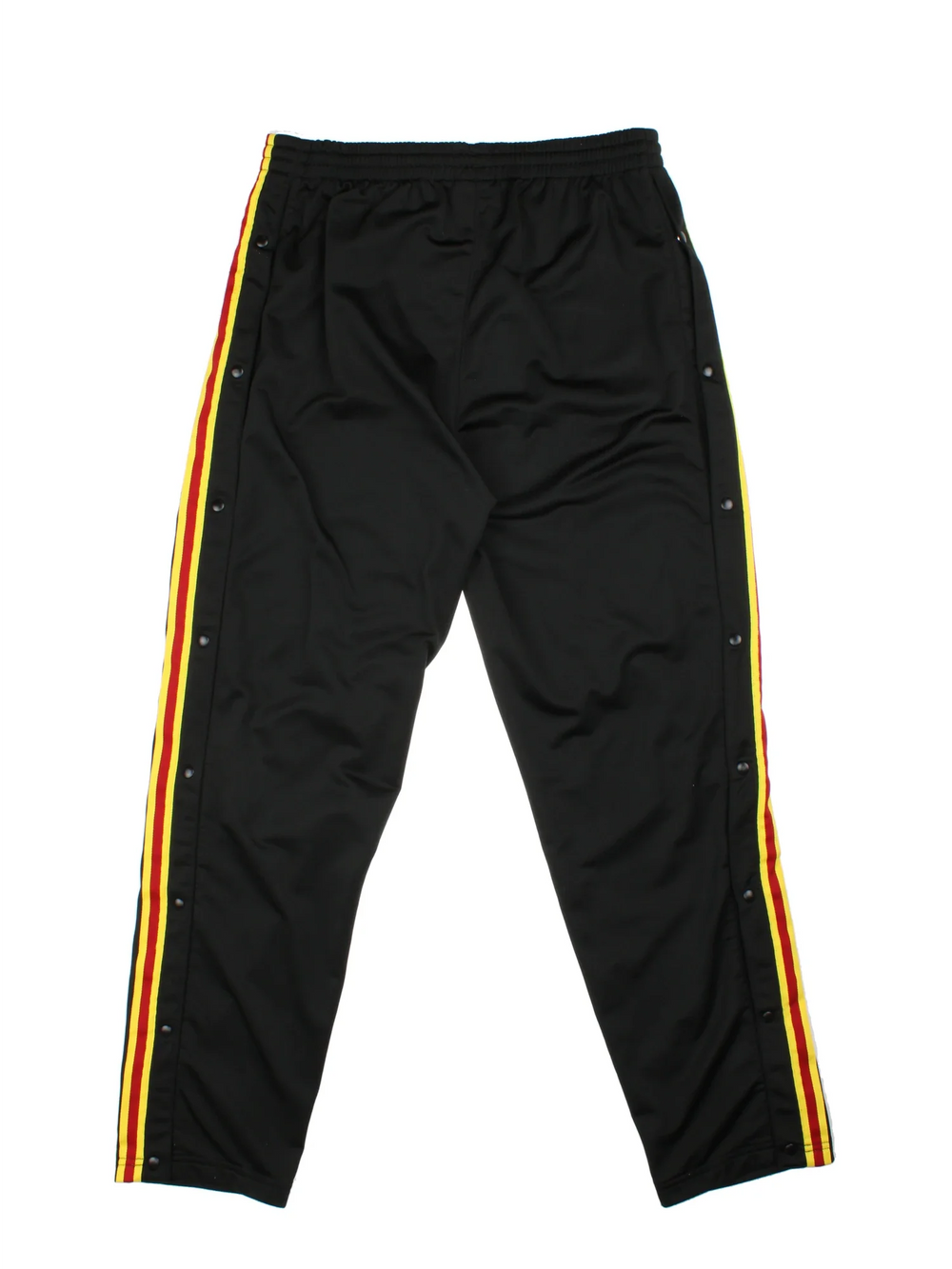 Reebok Popper Tracksuit Bottoms in a black colourway with yelow and red stripes going down the sides alongside popper button openings, has pockets, elasticated waist with drawstring, and the logo embroidered on the front.