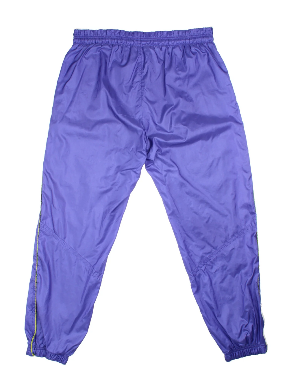 Vintage 80's Nike Shell Pants in a purple colourway with pockets, elasticated waist with drawstring, cotton blend lining, and the logo embroidered on the front.