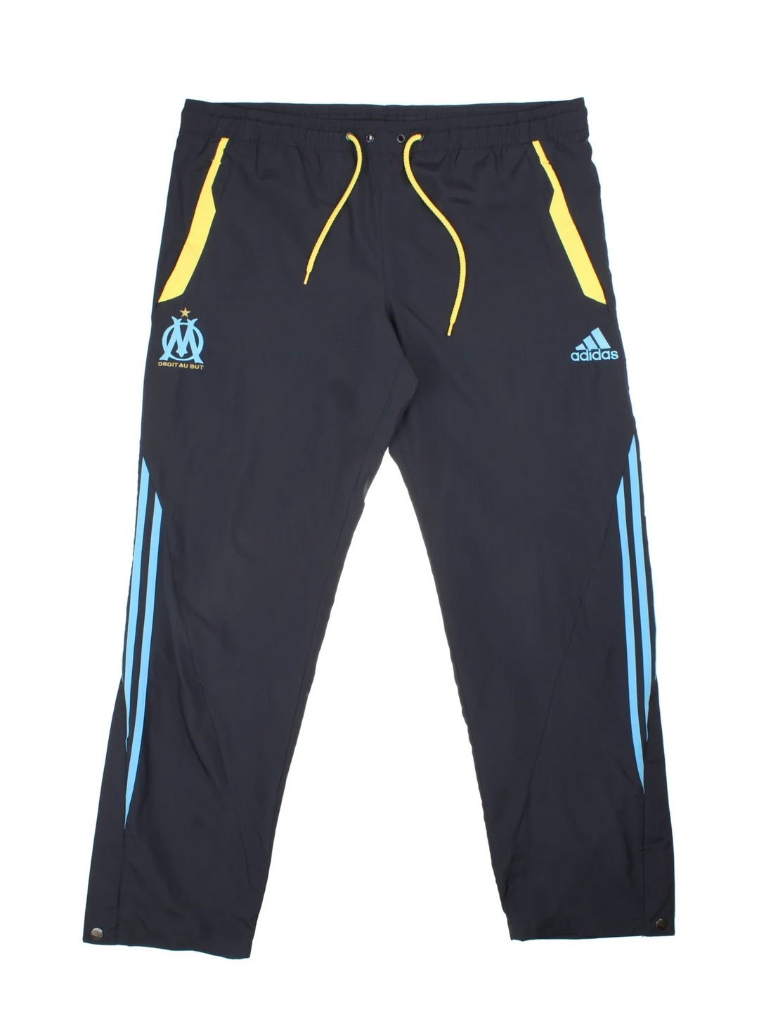 2009/10 Olympique Marseille Adidas Tracksuit Bottoms in a grey colourway with blue and yellow detailing, has pockets, elasticated waist with drawstring, mesh lining, and the logos embroidered on the front.