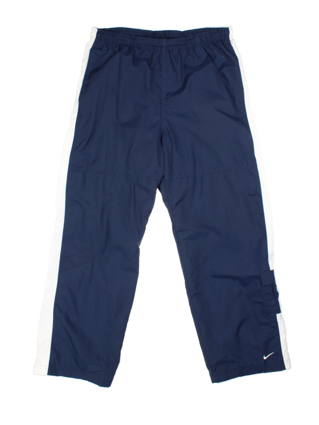 Nike Tracksuit Bottoms in blue colourway with white stripes down the legs, has pockets, elasticated waist with drawstring, cotton blend lining, and the logo embroidered on the front.