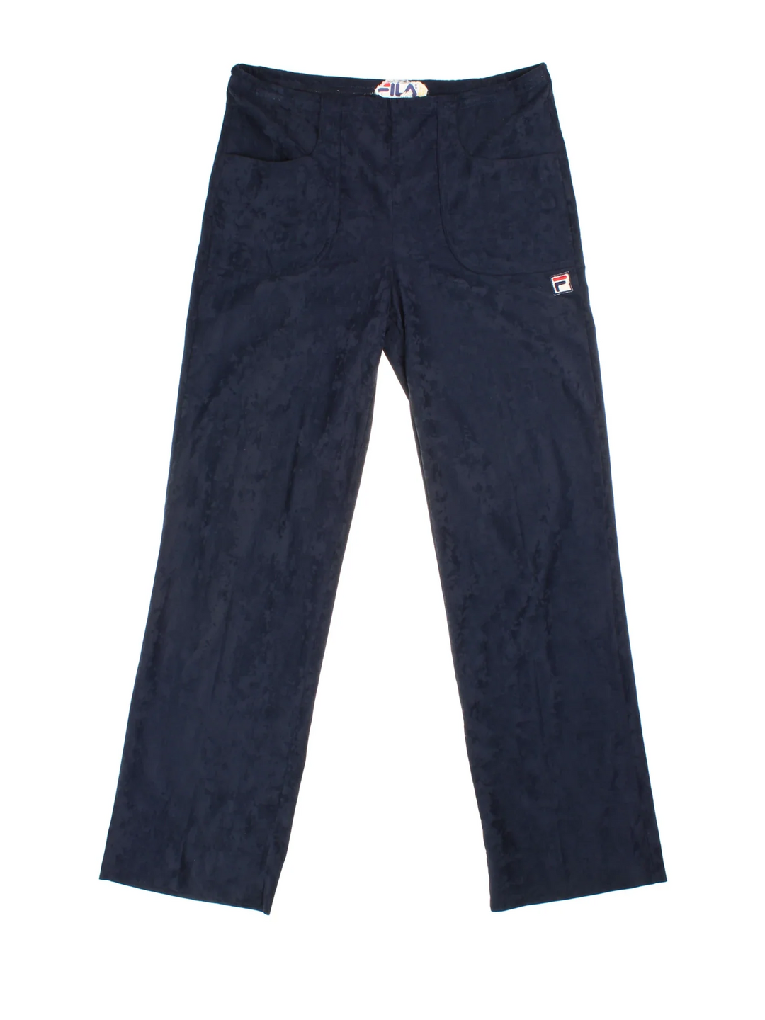 Vintage Fila Velour Tracksuit Bottoms in a navy blue colourway, has pockets, adjustable waist with drawstring, and the logo embroidered on the front.