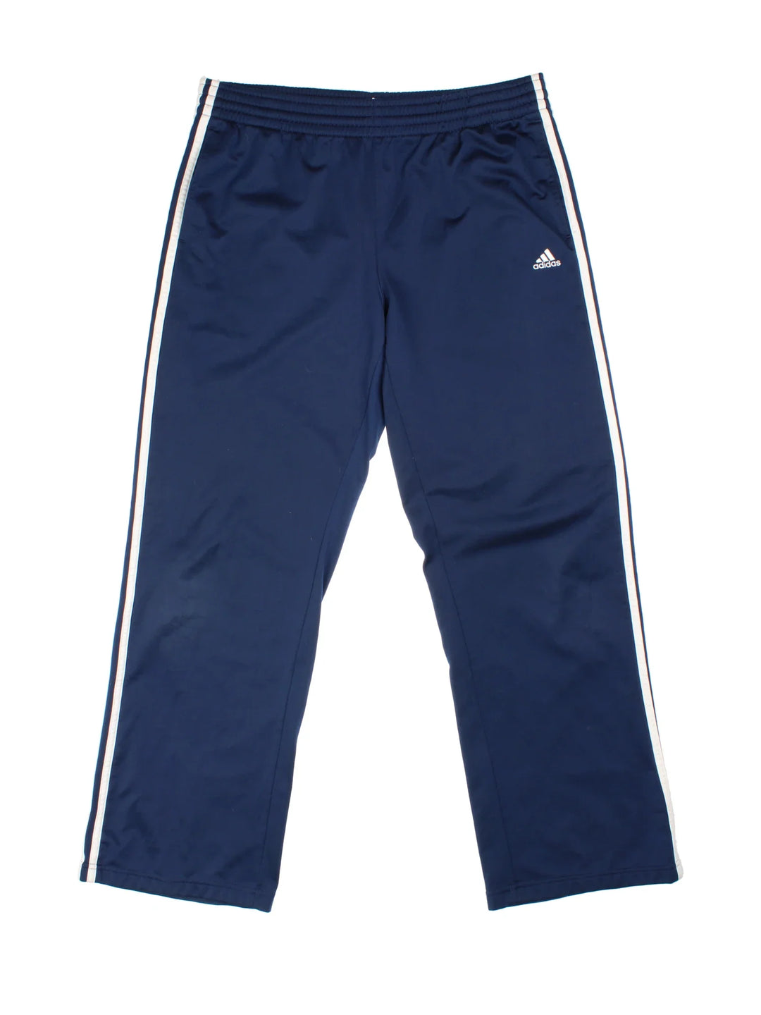 Adidas Tracksuit Bottoms in blue colourway with iconic three stripes in white going down the legs, has pockets, elasticated waist with drawstring, and the logo embroidered on the front.