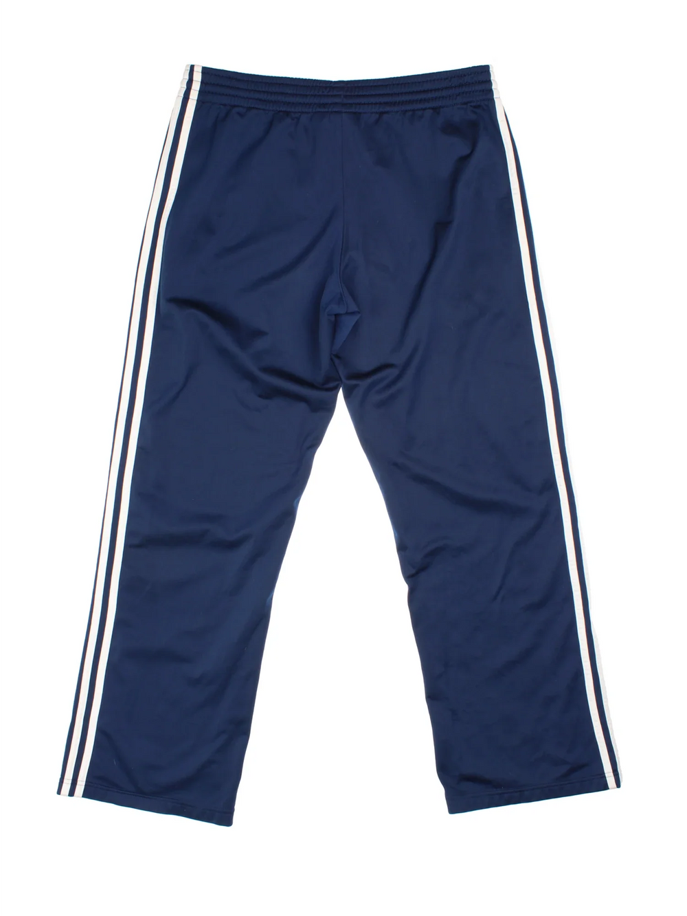 Adidas Tracksuit Bottoms in blue colourway with iconic three stripes in white going down the legs, has pockets, elasticated waist with drawstring, and the logo embroidered on the front.
