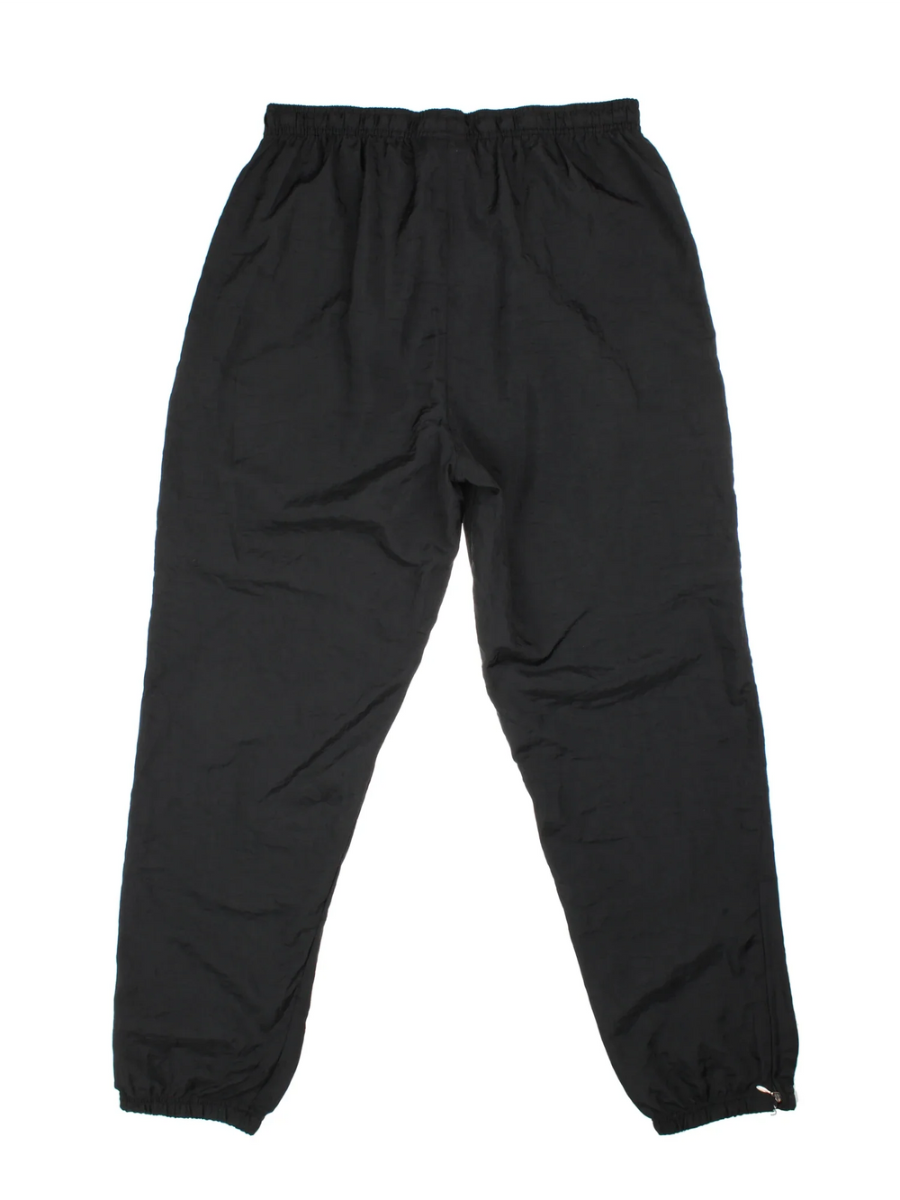 Vintage Adidas Shell Pants in black colourway, has pockets, elasticated waist with drawstring, and the logo embroidered on the front.