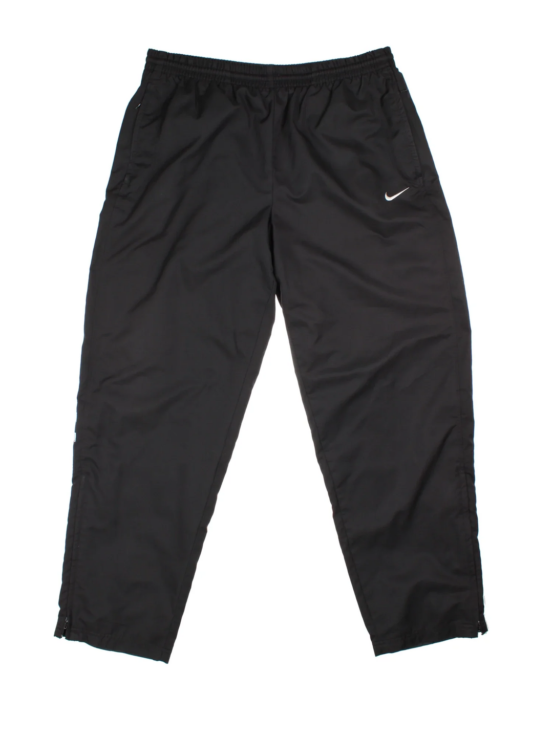 90's Nike Tracksuit Bottoms in black colourway, has pockets, elasticated waist with drawstring, cotton blend lining, and the logo embroidered on the front.