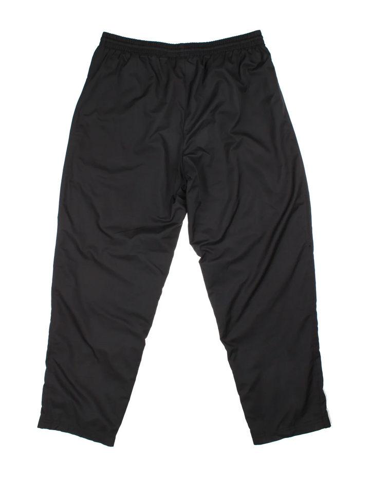 90's Nike Tracksuit Bottoms in black colourway, has pockets, elasticated waist with drawstring, cotton blend lining, and the logo embroidered on the front.