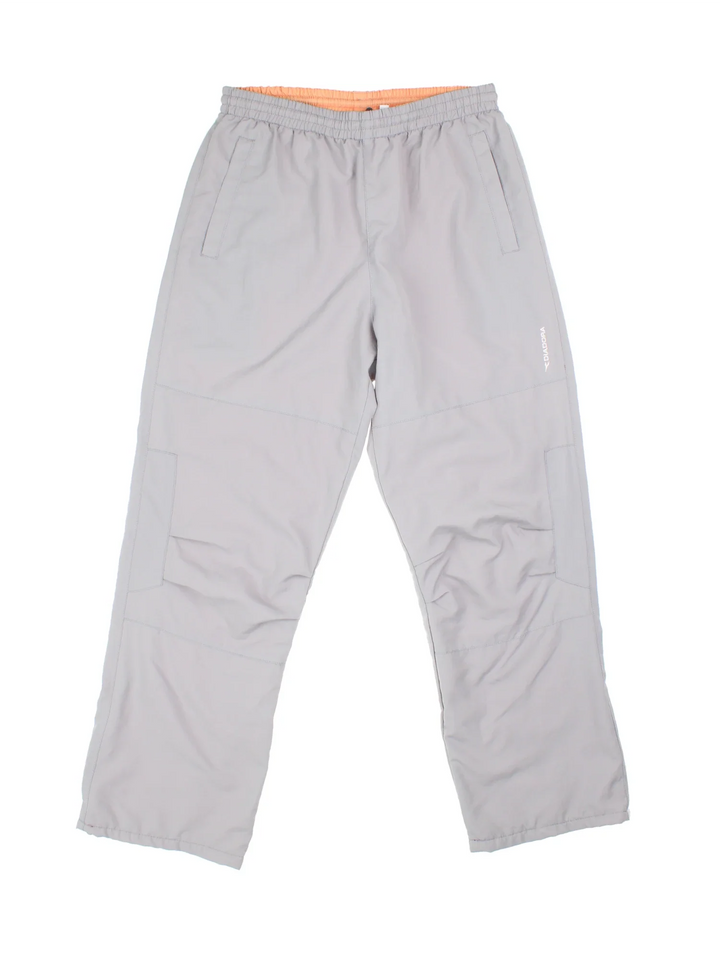 Y2K Diadora Tracksuit Bottoms in grey colourway, has pockets, elasticated waist with drawstring, and the logo embroidered on the front.