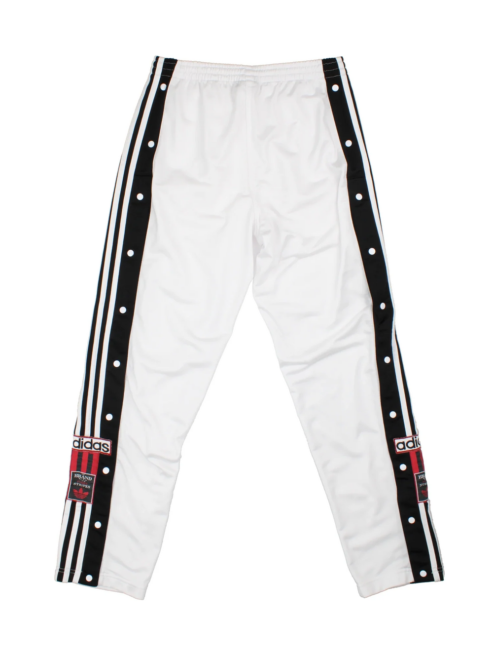 Vintage 90's Adidas Popper Tracksuit Bottoms in white and black colourway, has pockets, elasticated waist with drawstring, and the logo embroidered down the side of the legs alongside popper buttons.