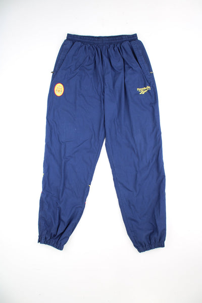 Vintage Reebok Liverpool FC tracksuit bottoms. Features embroidered logo on the front and back, and elasticated drawstring waist.