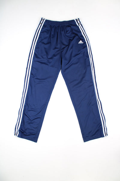 Vintage Adidas popper tracksuit bottoms with elasticated waist, featuring embroidered logo.
