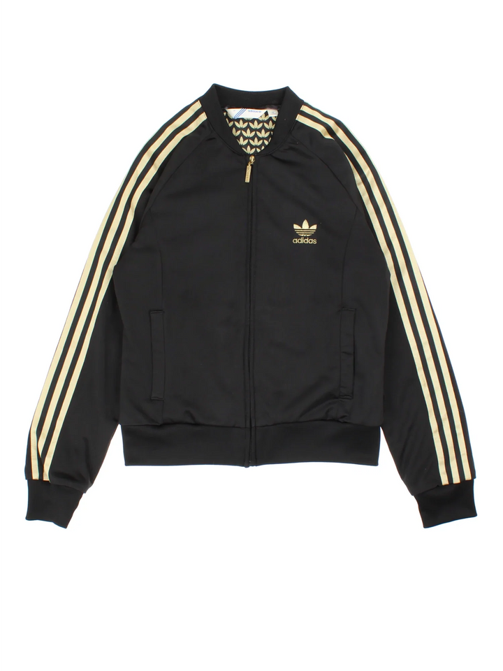 Vintage Adidas Originals Track Top in a black/gold colourway. Zips up and has side pockets, famous x3 stripes and trefoil embroidered branding on front and back.
