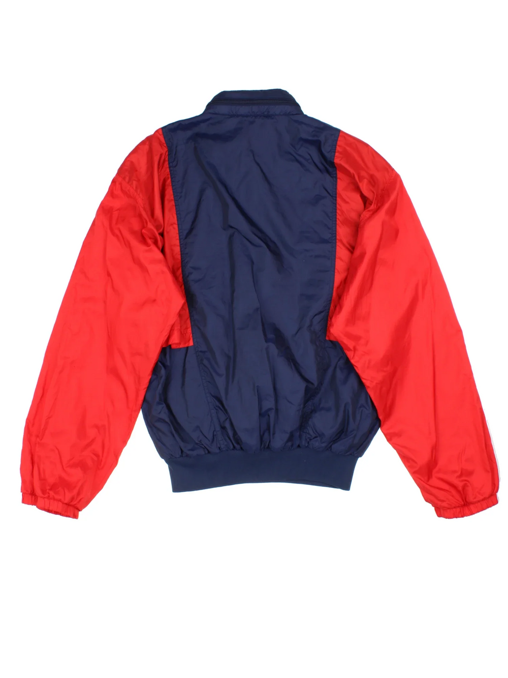 Vintage 90's Adidas Windbreaker Jacket in a blue/red colourway. 1/4 zip fastening, front pocket (which turns into bag), insulated with a brushed jersey lining, and has the logo embroidered on the front.
