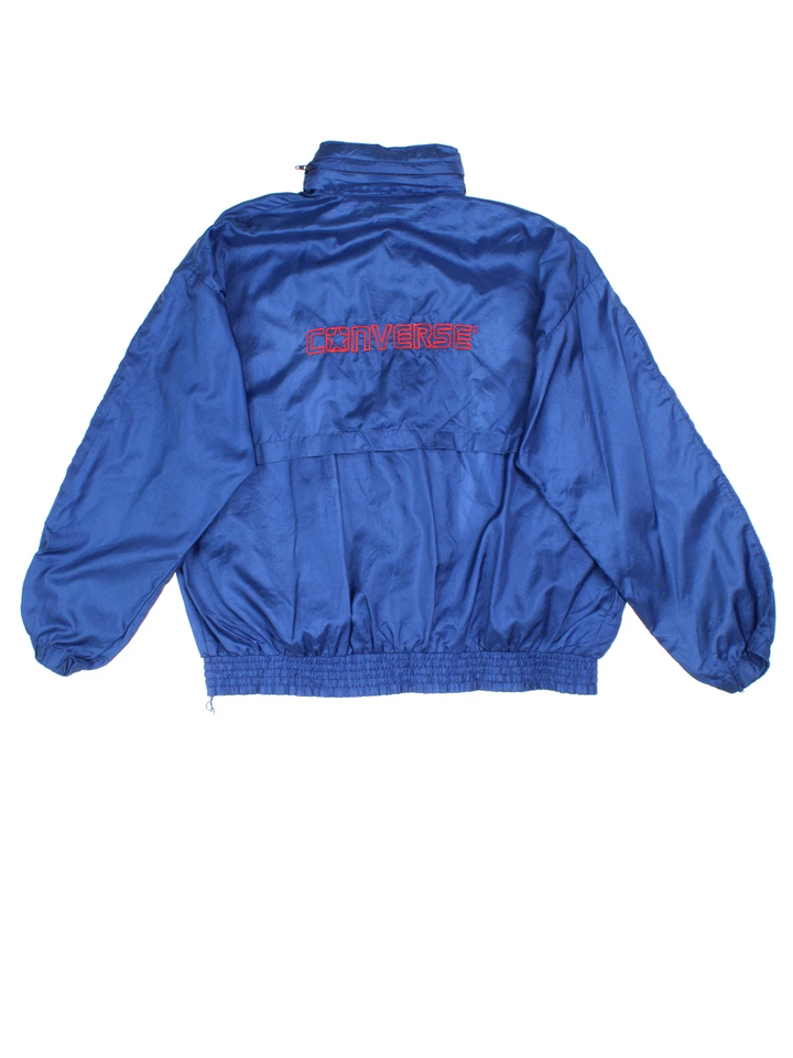 Vintage 90's Converse Tracksuit Jacket in a blue colourway. Zip up fastening, side pockets and has the logo embroidered on the front/back.