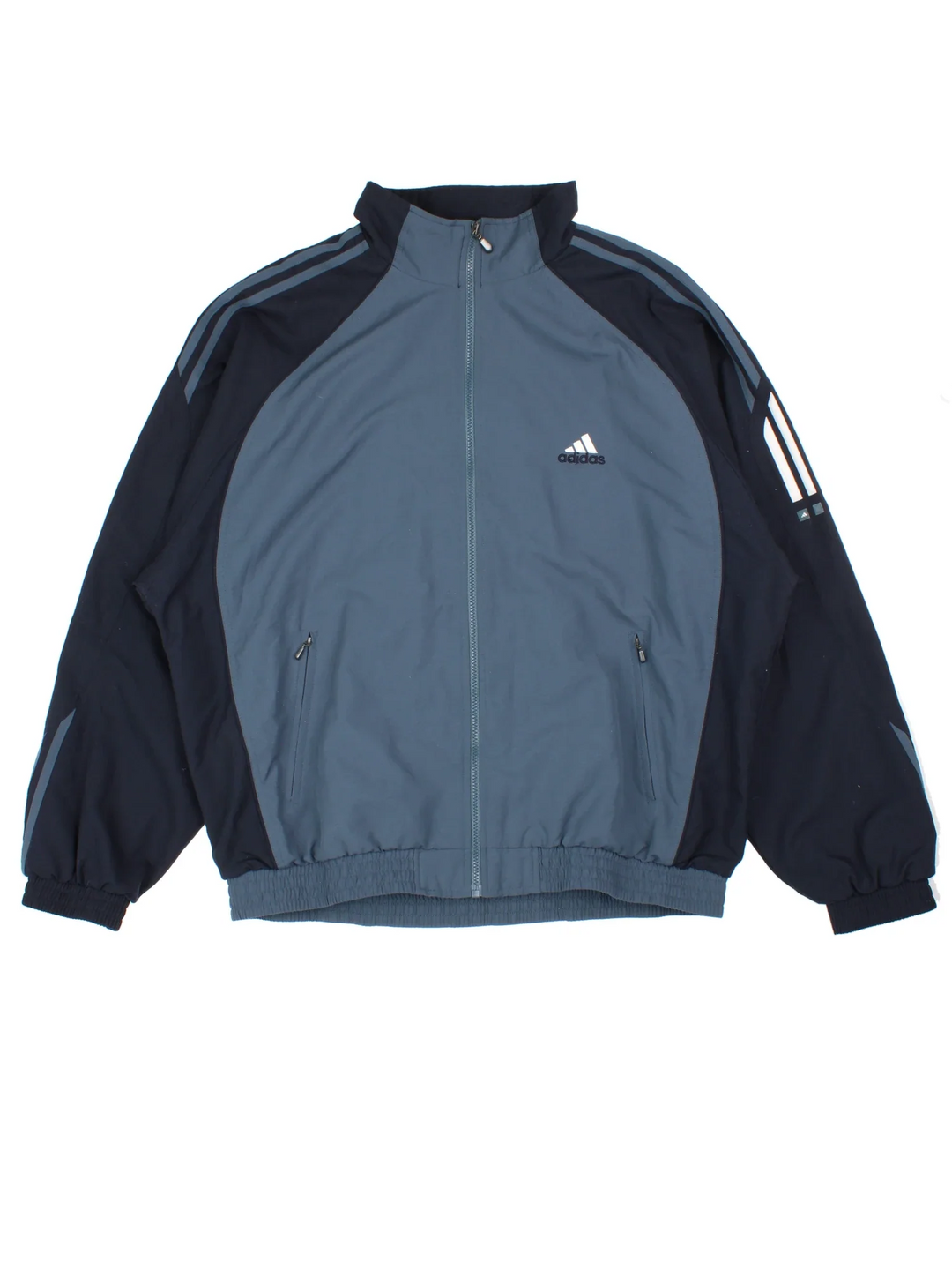 Adidas Tracksuit Top in a grey/black colourway. Zip up fastening, side pockets, mesh lining and has the logo embroidered on the front.
