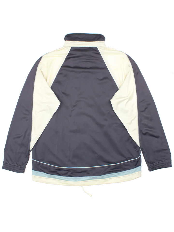90's Fila Tracksuit Top in a grey/cream colourway. Zip up fastening, side pockets, brushed lining and has the logo embroidered on the front.