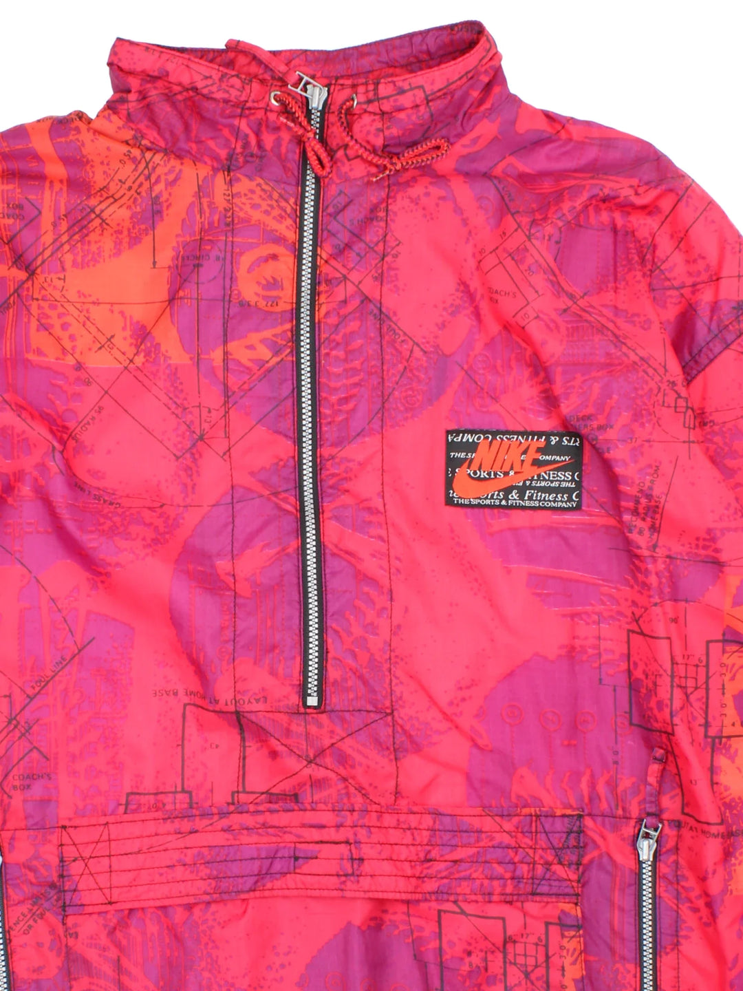 Vintage 90's Nike Windbreaker in a red and purple colourway. Half zip closure and has multiple pockets, and the logo embroidered on the front.