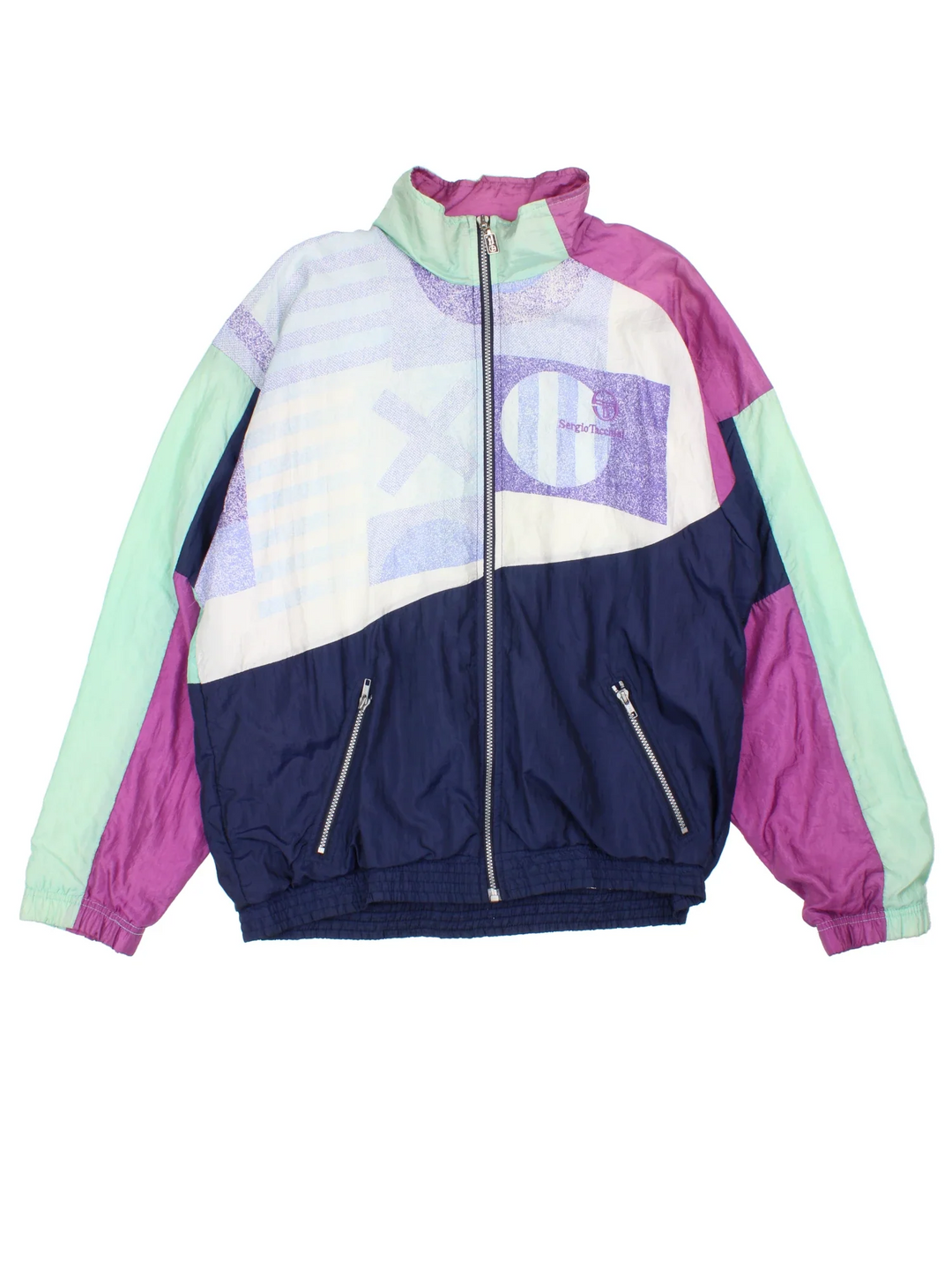 Vintage Sergio Tacchini Shell Jacket in a blue  and purple colourway. Zip up closure and has side pockets, and the logo embroidered on the front.