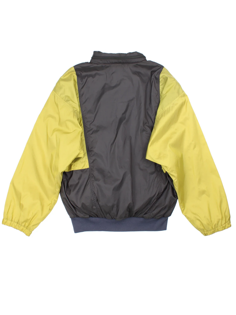 Vintage Adidas Windbreaker in a grey and yellow colourway. Half zip up closure and has multiple pockets, hiiden hood, the logo embroidered on the front, and can turn into a bag.