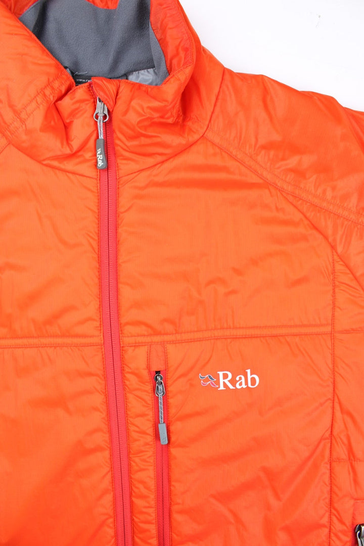 Rab Generator Lightweight Puffer Jacket in a orange colourway. Full zip with multiple pockets, drawstring hem and small classic logo on the front.