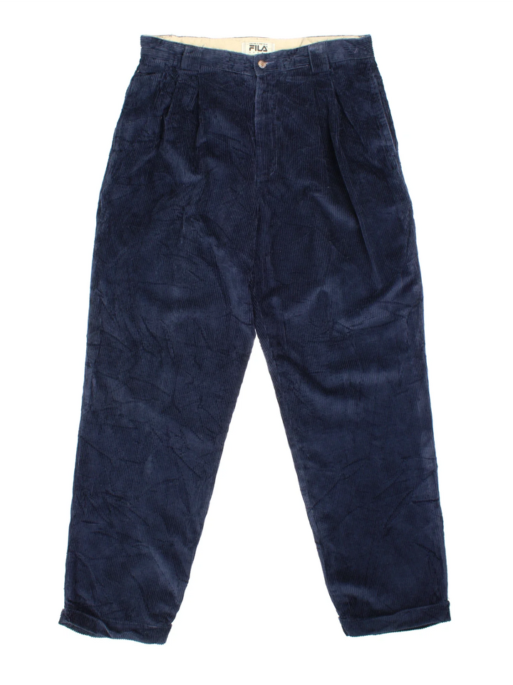 Vintage Fila Corduroy Trousers in blue colourway with multiple pockets and branded buttons.