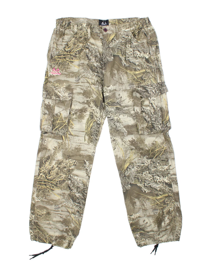 Real Tree Camo Cargo Trousers in a green and brown colourway with multiple pockets, and the logo printed on the front.