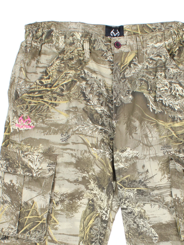 Real Tree Camo Cargo Trousers in a green and brown colourway with multiple pockets, and the logo printed on the front.