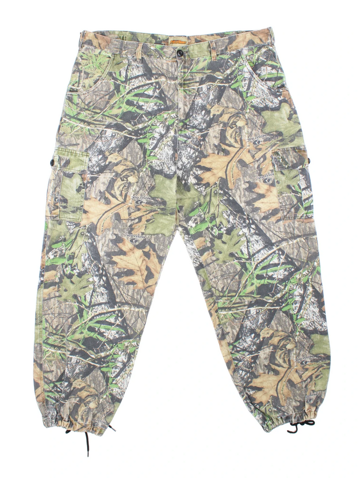 Mossy Oak Real Tree Camo Cargo Trousers in a green and brown colourway with multiple pockets.