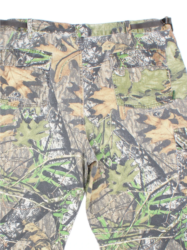 Mossy Oak Real Tree Camo Cargo Trousers in a green and brown colourway with multiple pockets.