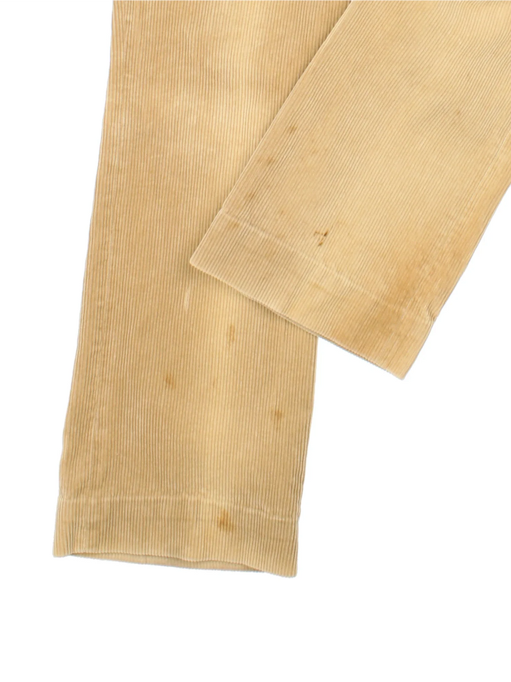Lacoste Cordurory Trousers in tan colourway with zip fly fastening and branding embroidered on the front.
