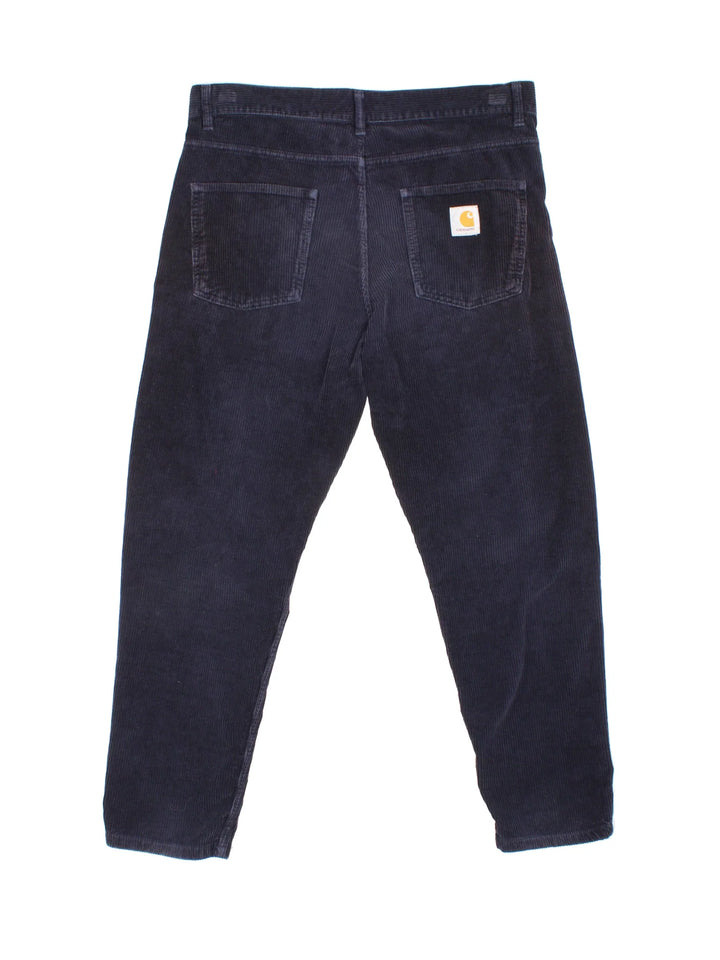 Carhartt Corduroy Trousers in blue colourway with multiple pockets and the logo embroidered on the back.