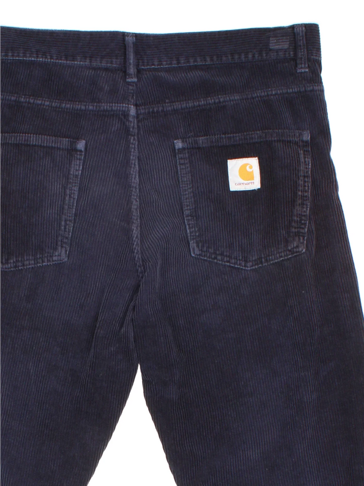 Carhartt Corduroy Trousers in blue colourway with multiple pockets and the logo embroidered on the back.