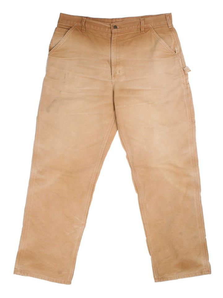 Carhartt Carpenter Jeans in a brown colourway with multiple pockets and leather logo on the back pocket.