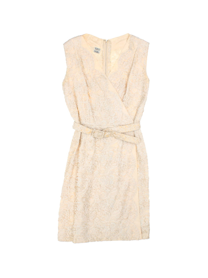 60s Harvey Nichols dress and jacket set in cream lace. Dress has zip closure in the back and a matching belt. Jacket has hook and eye closure and a Peter Pan collar.